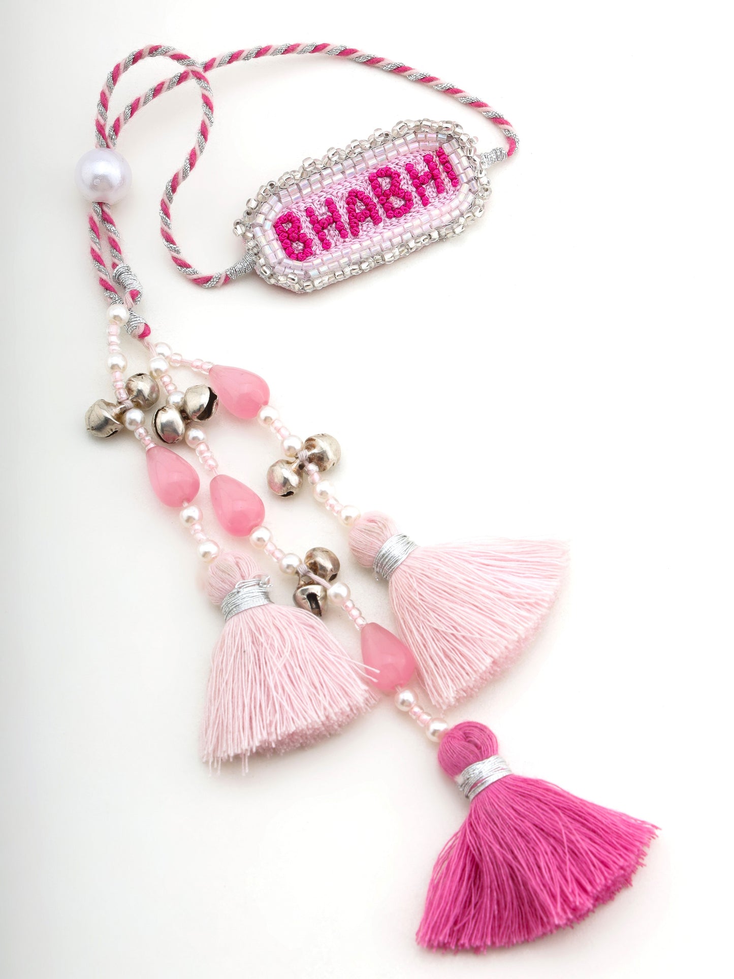 Decorative lumba rakhi with bhabhi text with stone and tassel details