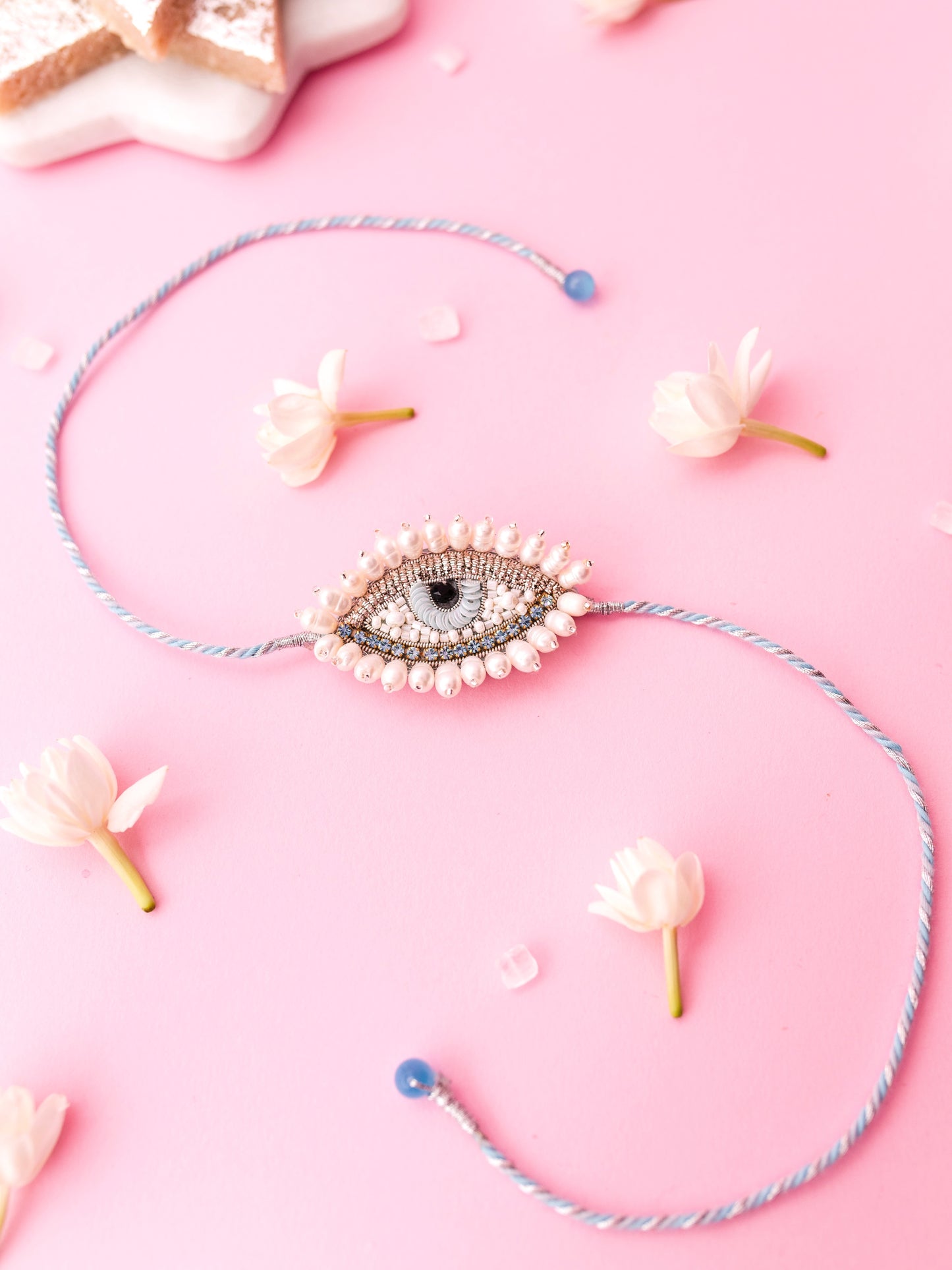 Decorative rakhi with an evil eye design