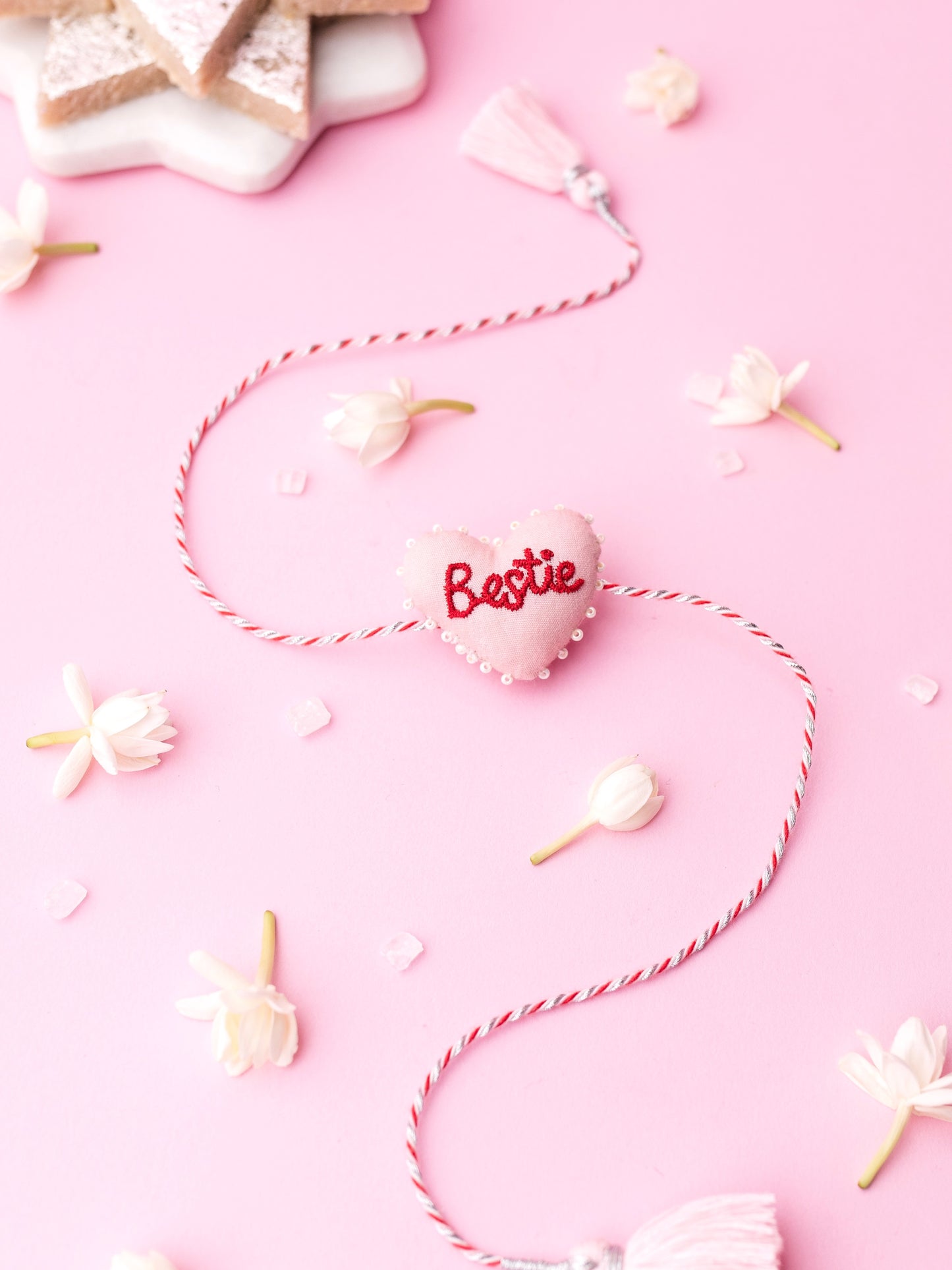 Decorative sister rakhi with heart-shaped 3D bestie text