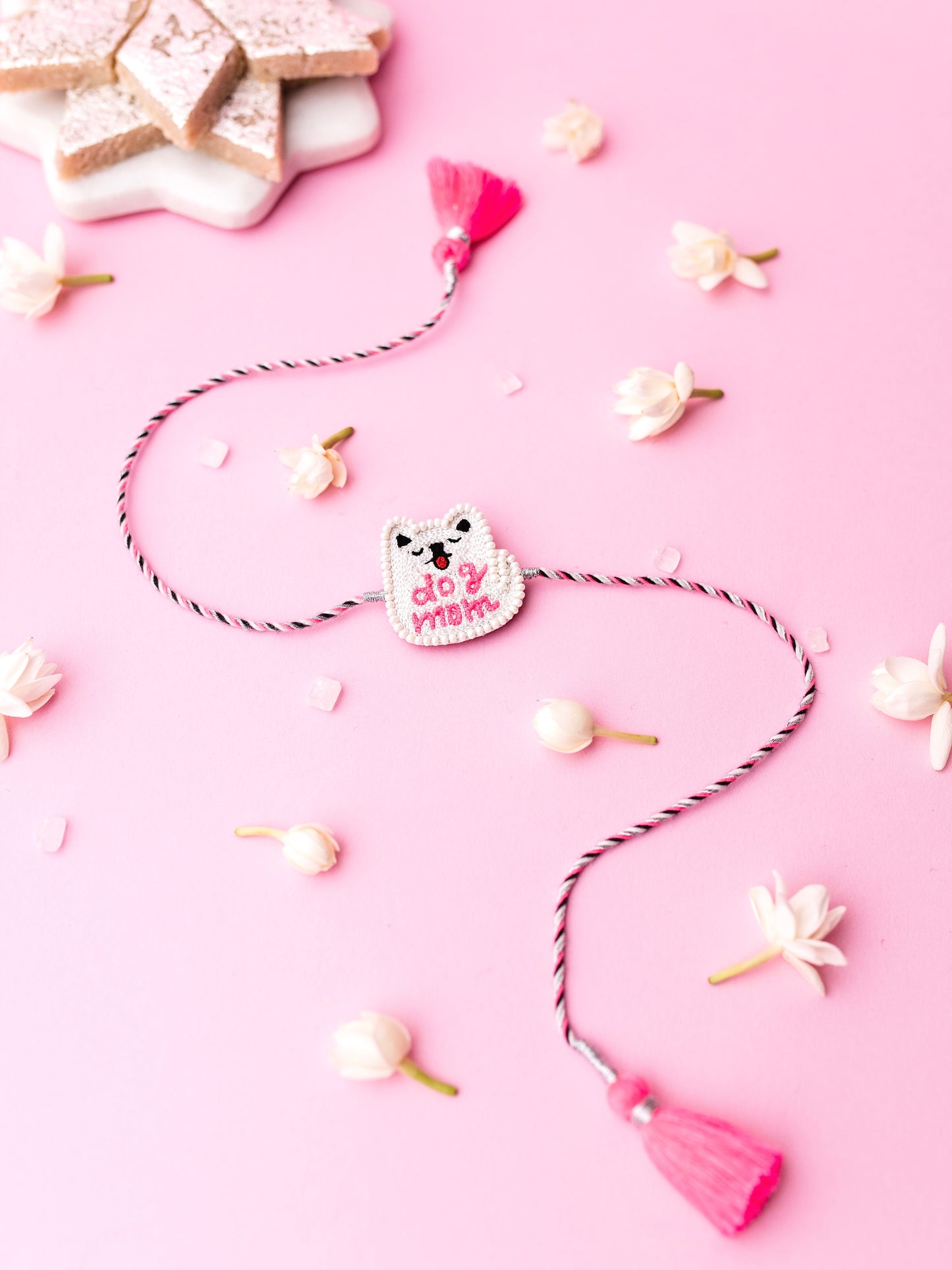 Decorative sister rakhi with dog mom text