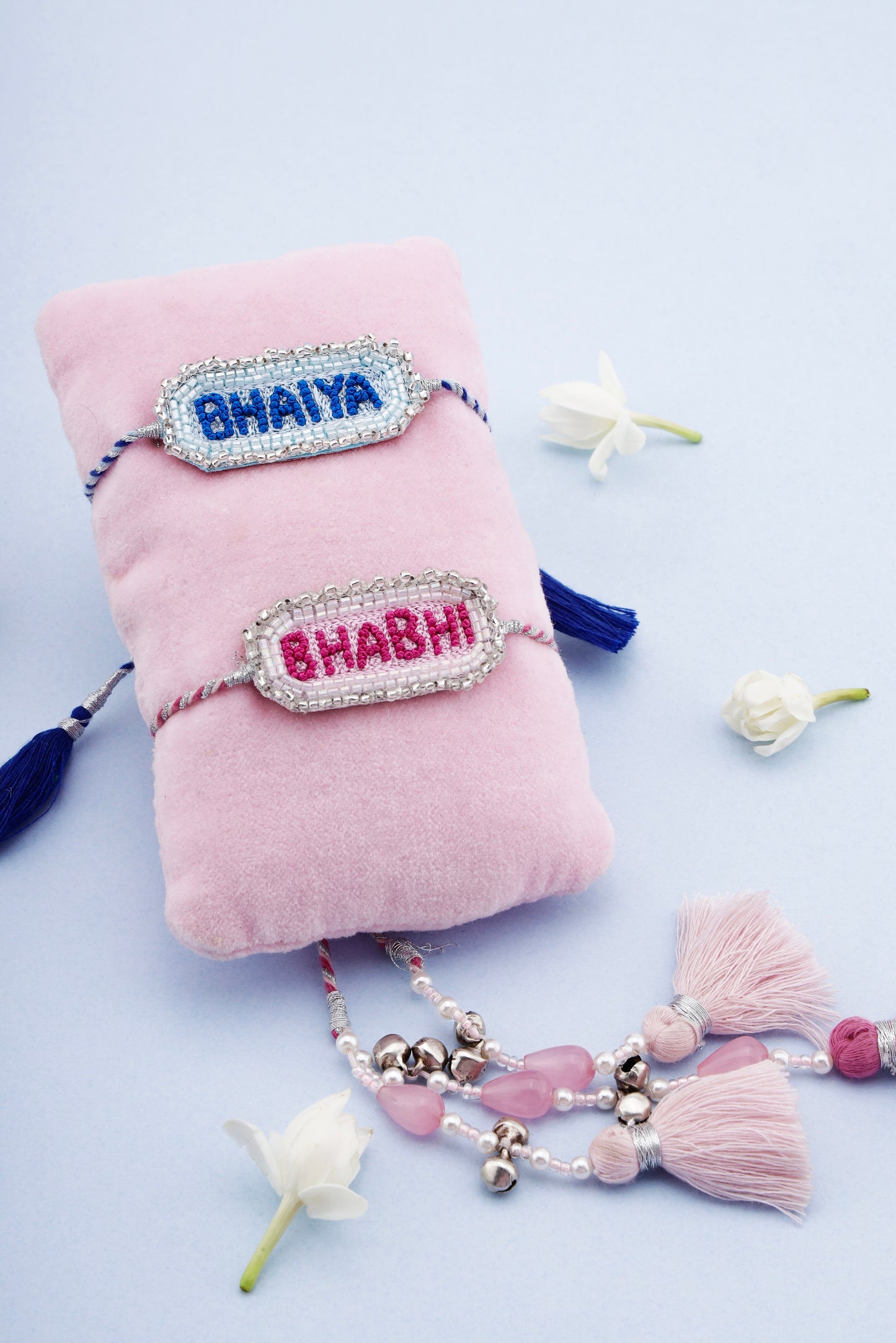 Decorative rakhi and lumba combo with bhaiya and bhabhi text with stone and tassel details