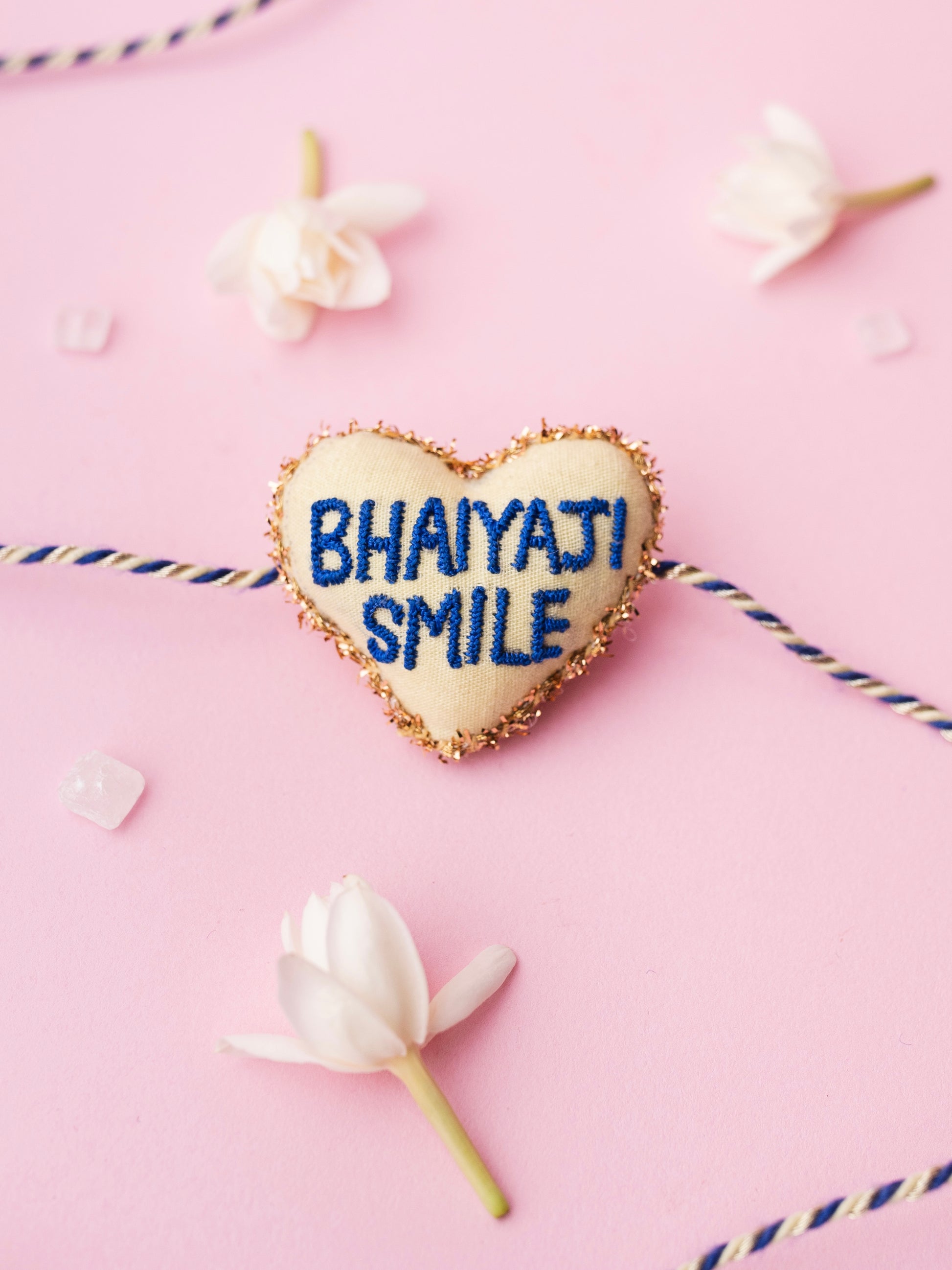 Decorative rakhi with bhaiyaji smile text 