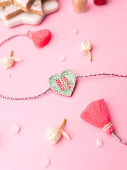 Decorative sister rakhi with heart-shaped big sis text