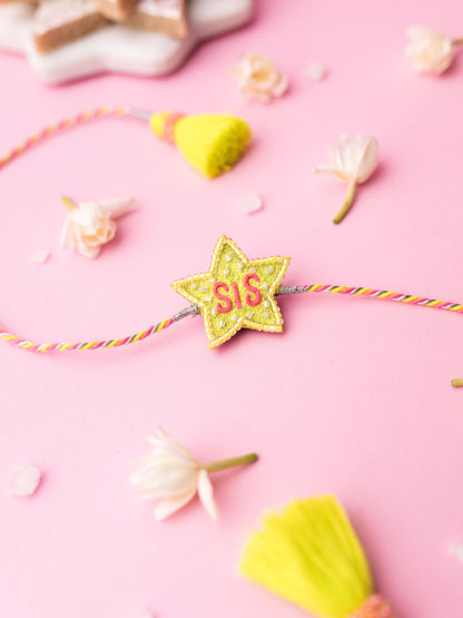 Decorative sister rakhi with star-shaped sis text