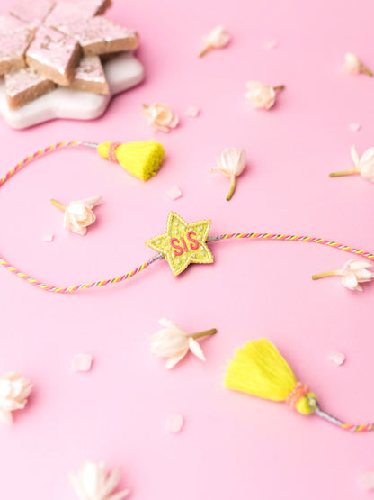 Decorative sister rakhi with star-shaped sis text