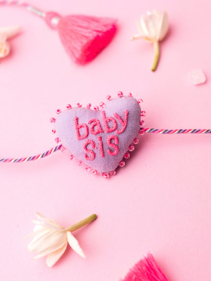 Decorative sister rakhi  with heart-shaped 3D baby sis text