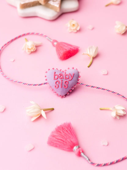 Decorative sister rakhi  with heart-shaped 3D baby sis text