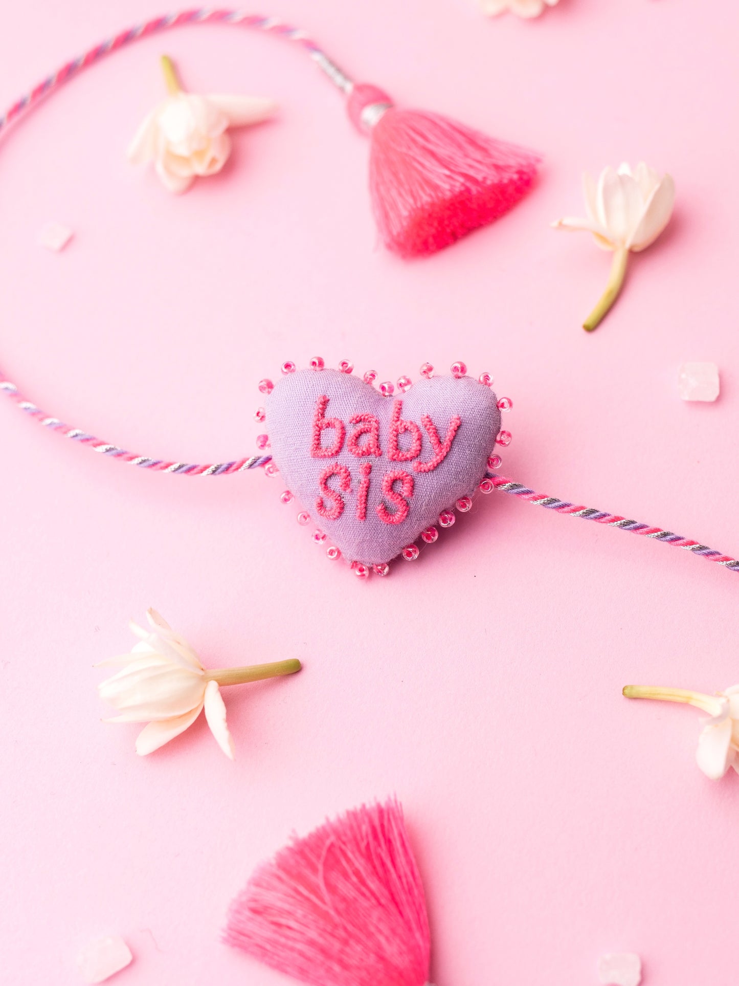 Decorative sister rakhi  with heart-shaped 3D baby sis text