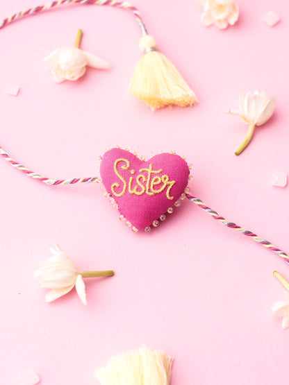 Decorative sister rakhi with heart-shaped 3D sister text