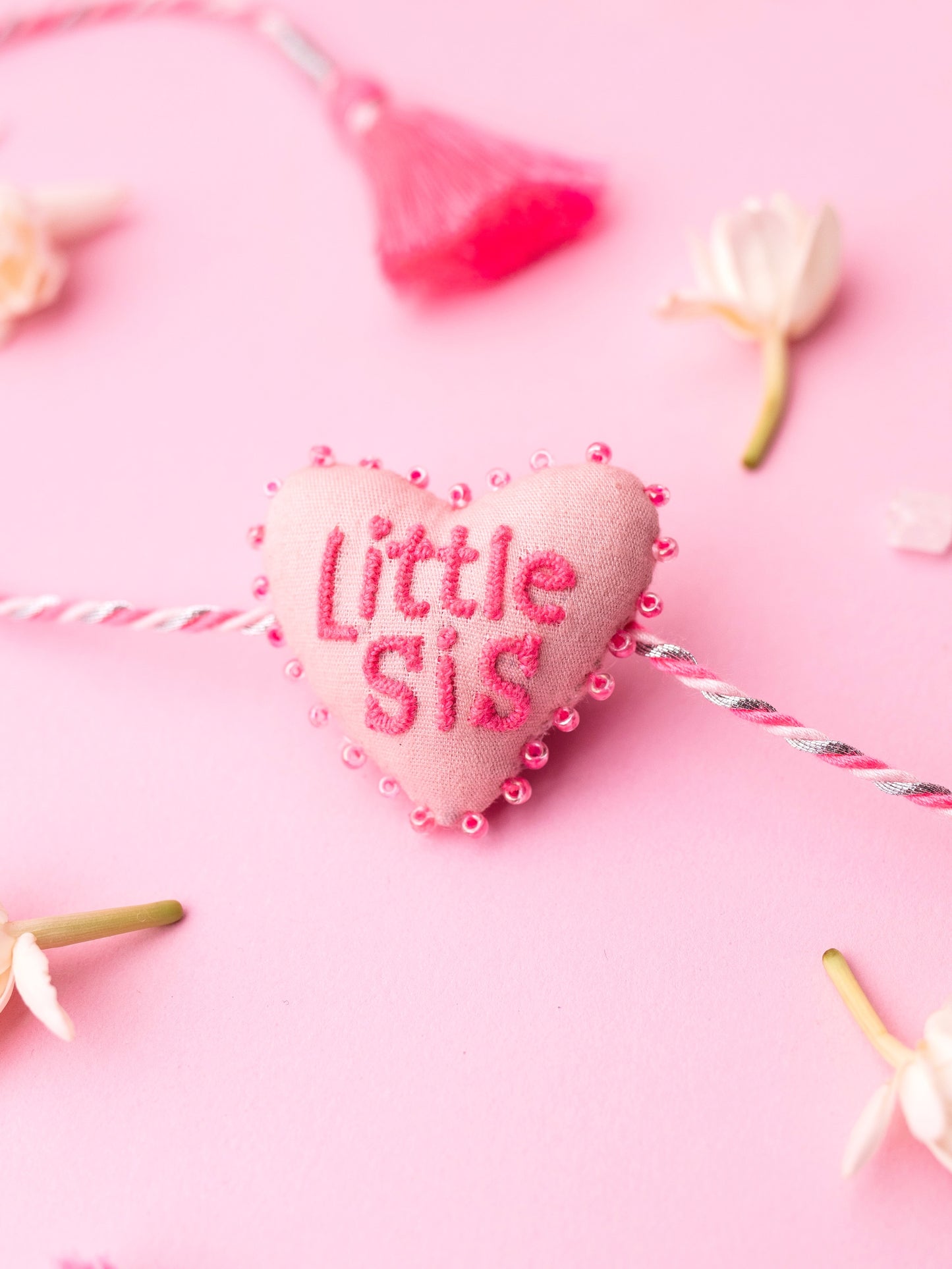 Decorative sister rakhi combo with heart-shaped 3D little sis text