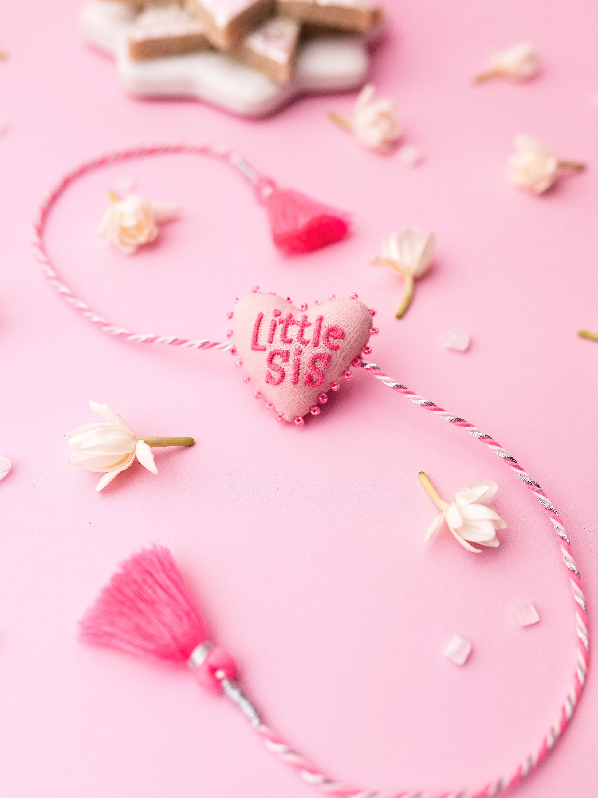 Decorative sister rakhi combo with heart-shaped 3D little sis text
