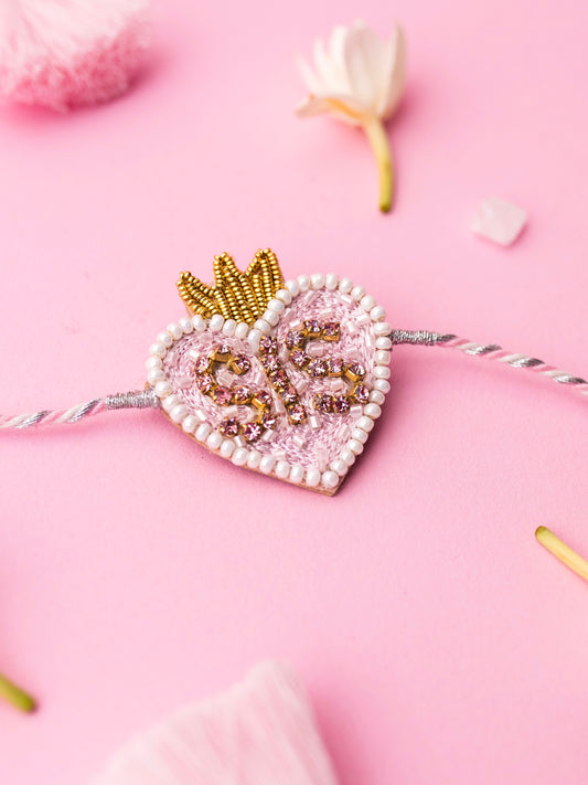 Decorative sister rakhi with heart-shaped sis text
