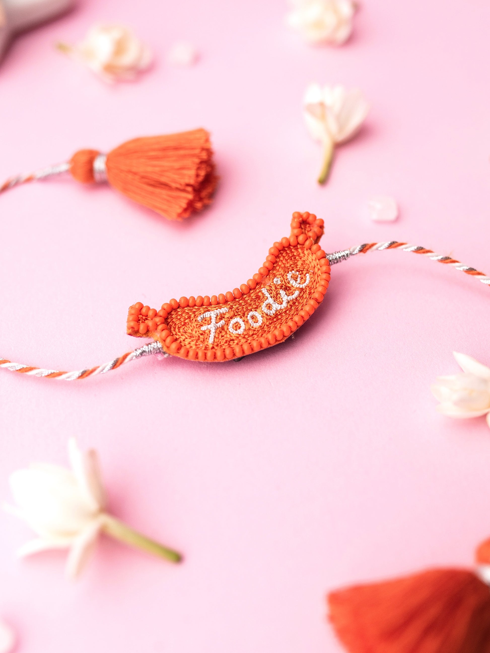 Decorative pet rakhi with foodie text