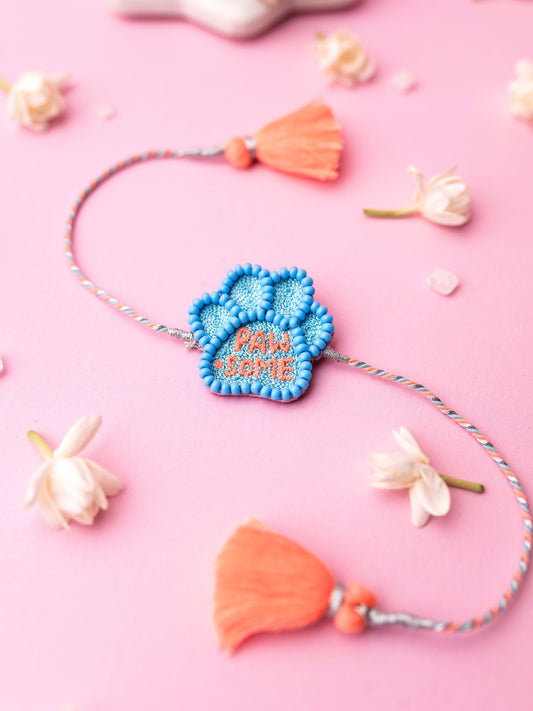 Decorative pet rakhi with pawsome text