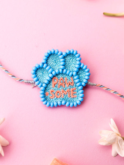 Decorative pet rakhi with pawsome text
