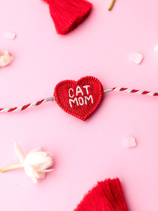Decorative sister rakhi with cat mom text