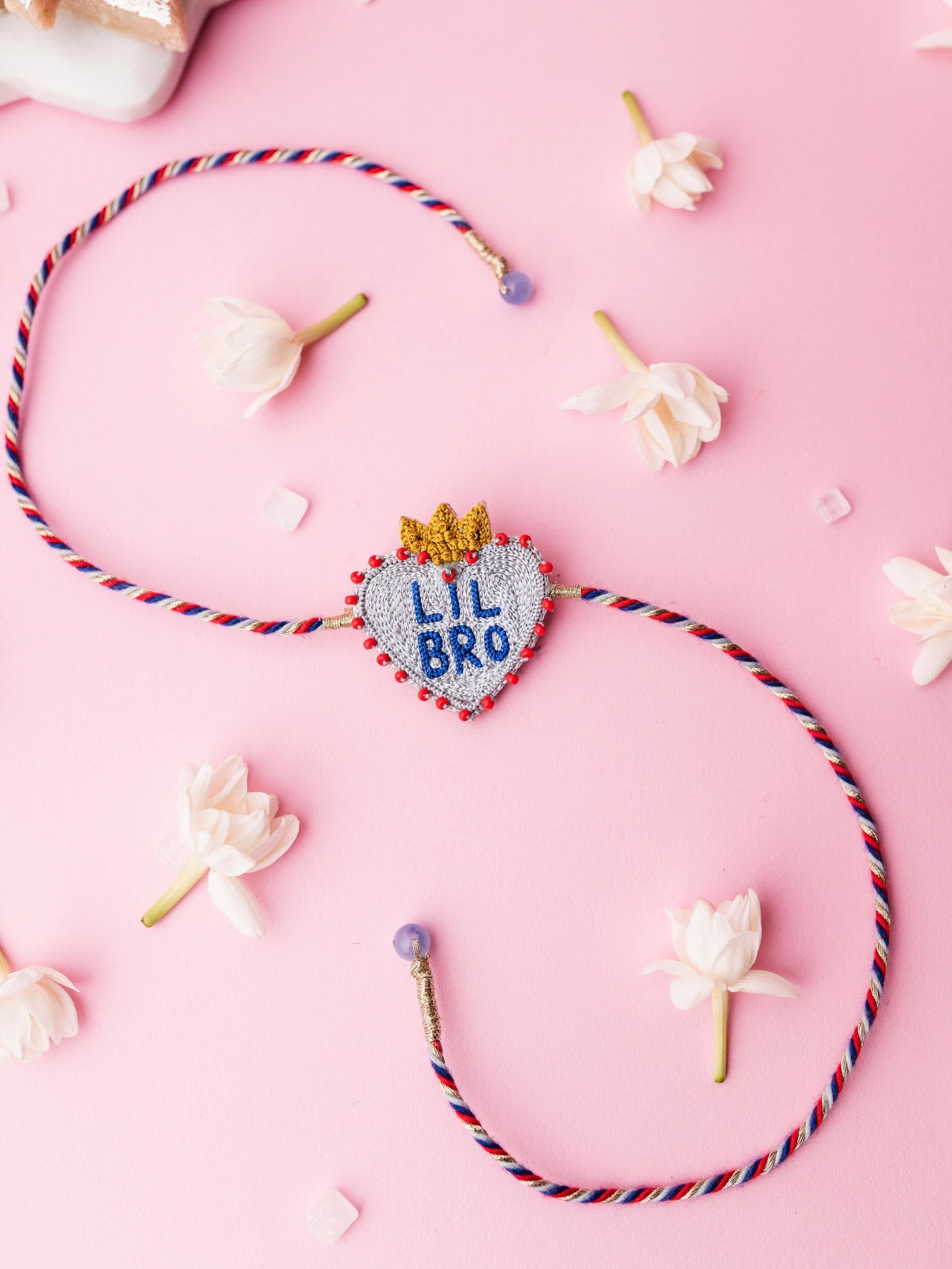 Decorative brother rakhi with  heart shaped lil bro text