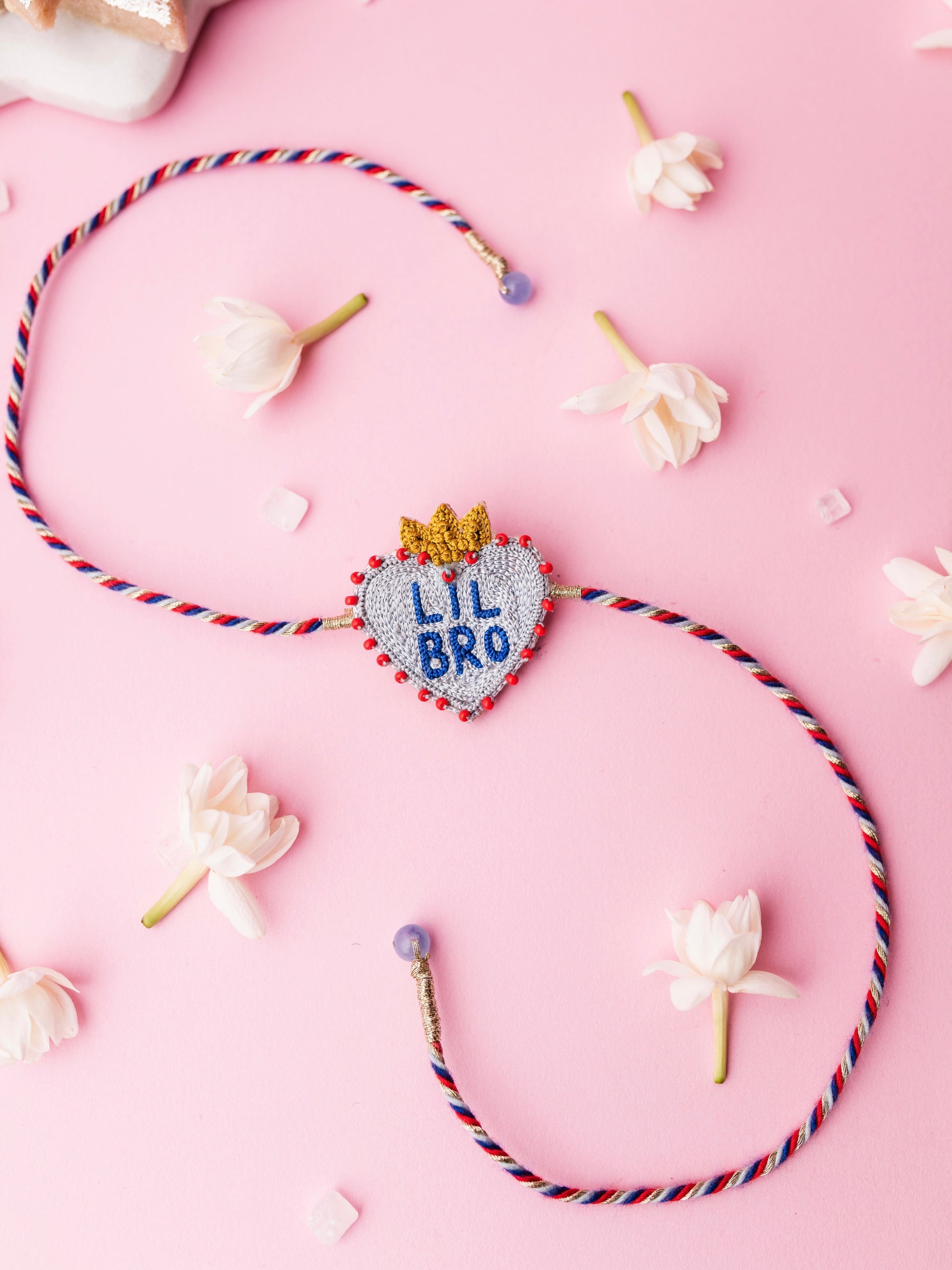 Decorative brother rakhi with  heart shaped lil bro text
