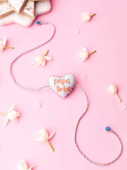 Decorative rakhi with papa to be text