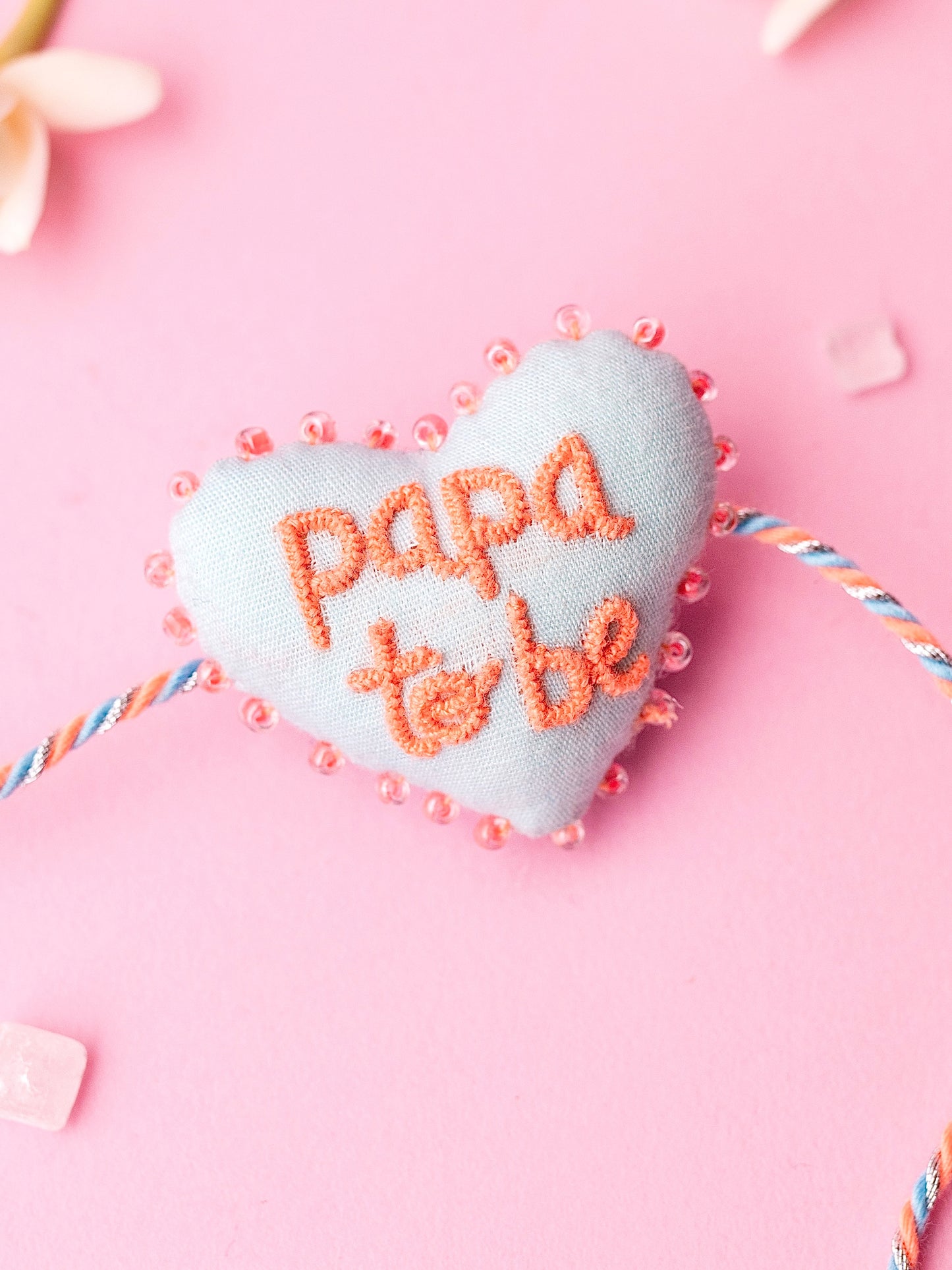 Decorative rakhi with papa to be