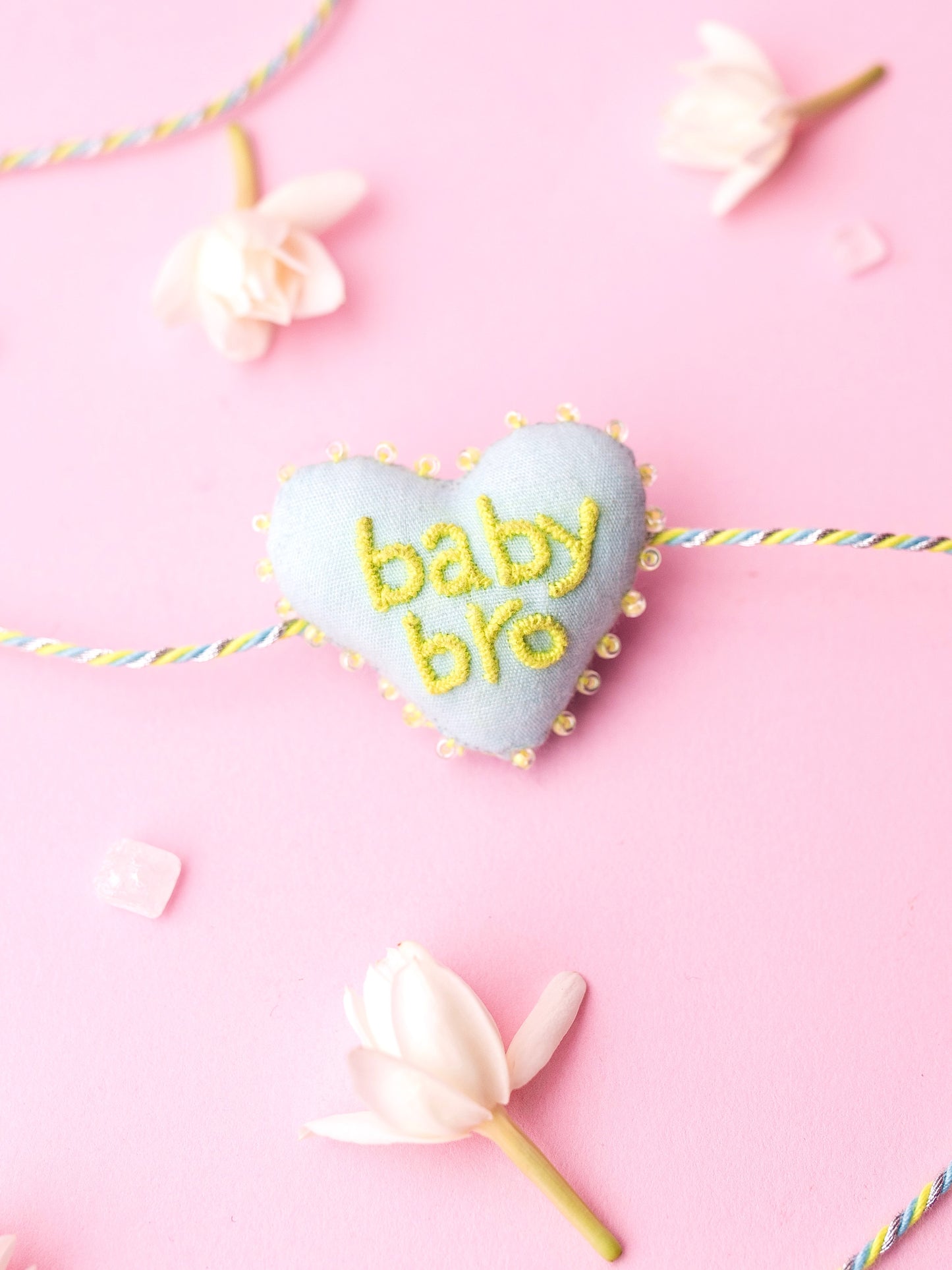 Decorative brother rakhi with baby bro  text