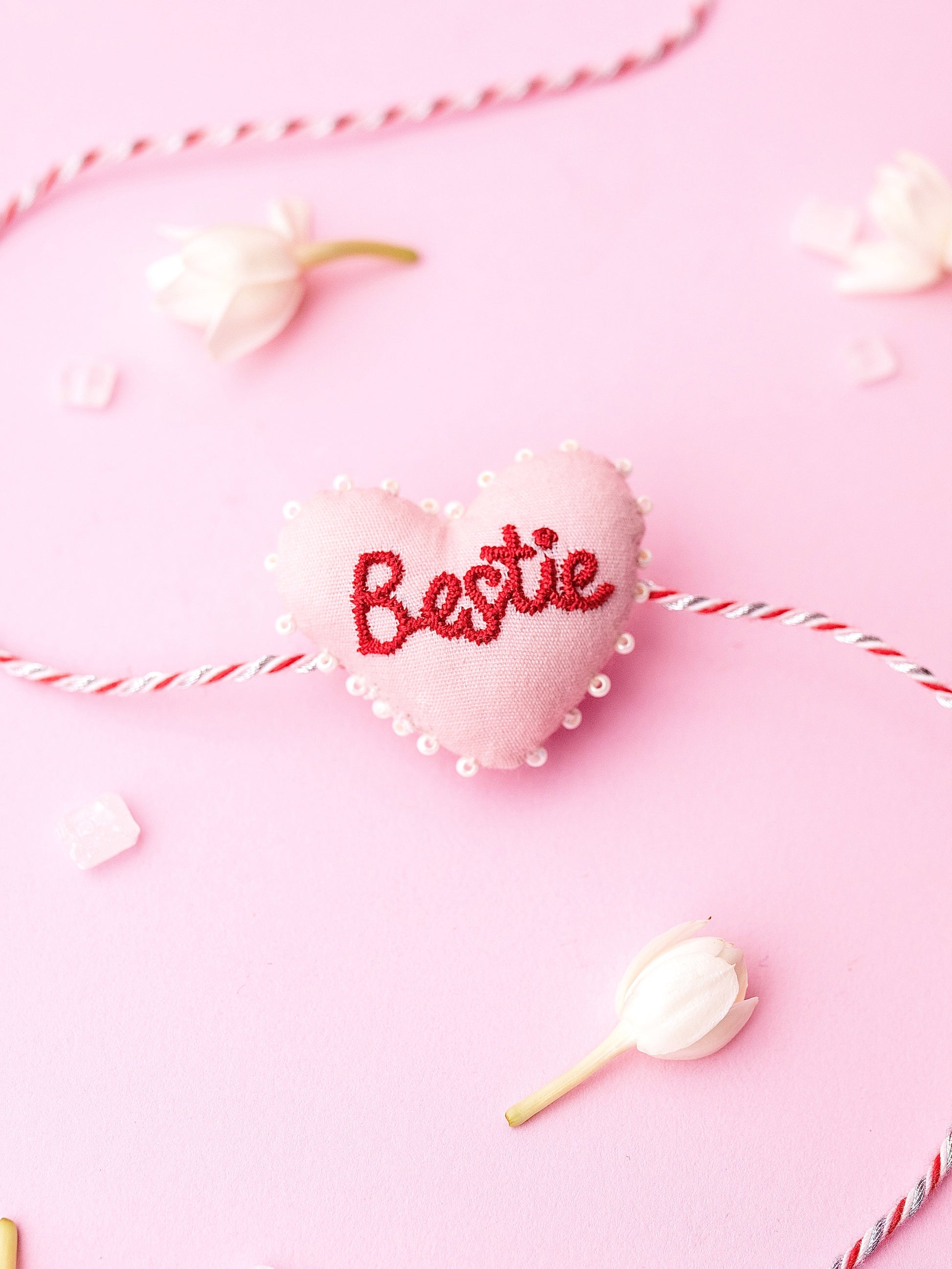 Decorative sister rakhi  with heart-shaped 3D bestie text