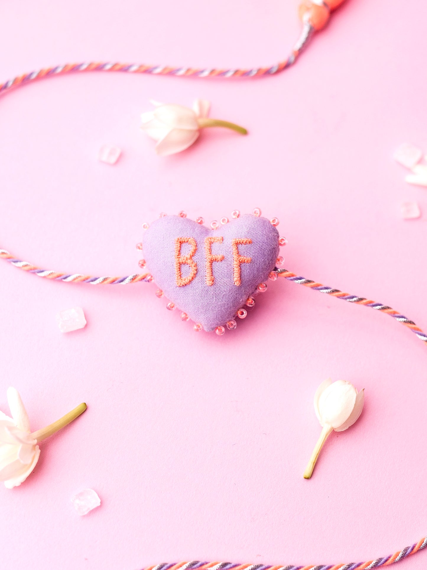 Decorative lavender sister rakhi  with heart-shaped 3D BFF text