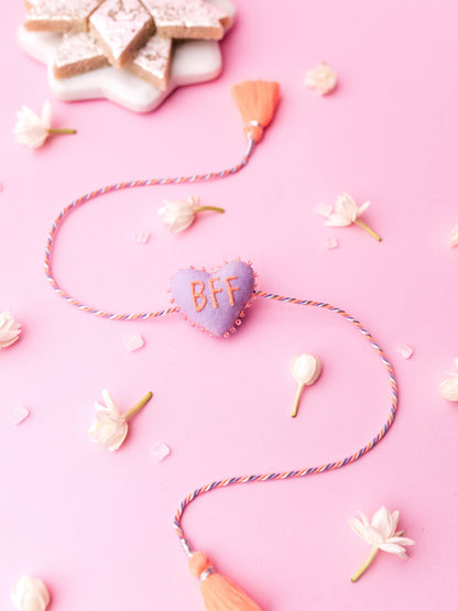 Decorative lavender sister rakhi  with heart-shaped 3D BFF text