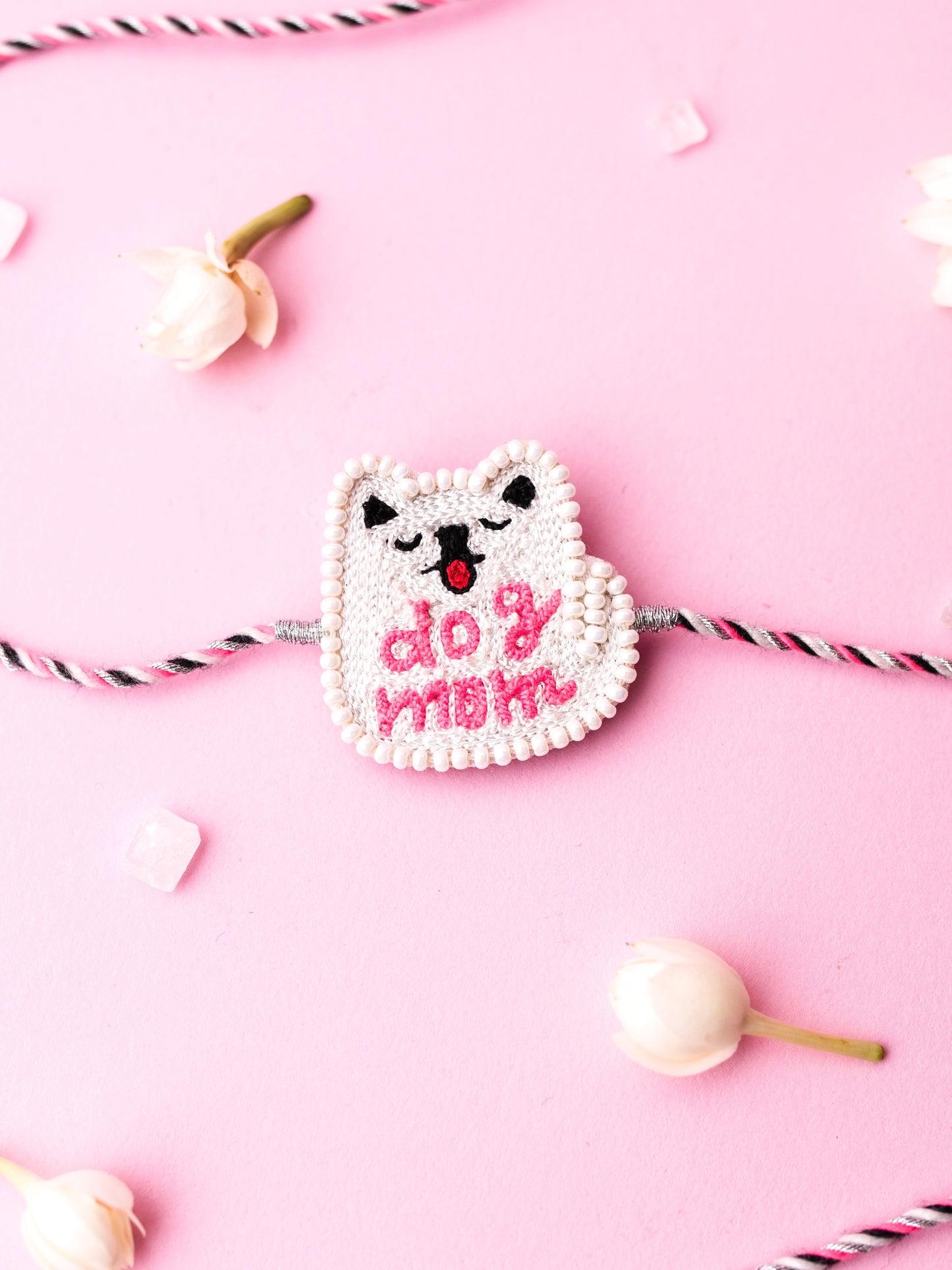 Decorative sister rakhi with dog mom text