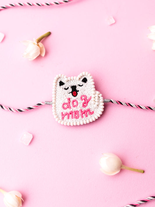 Decorative sister rakhi with dog mom text