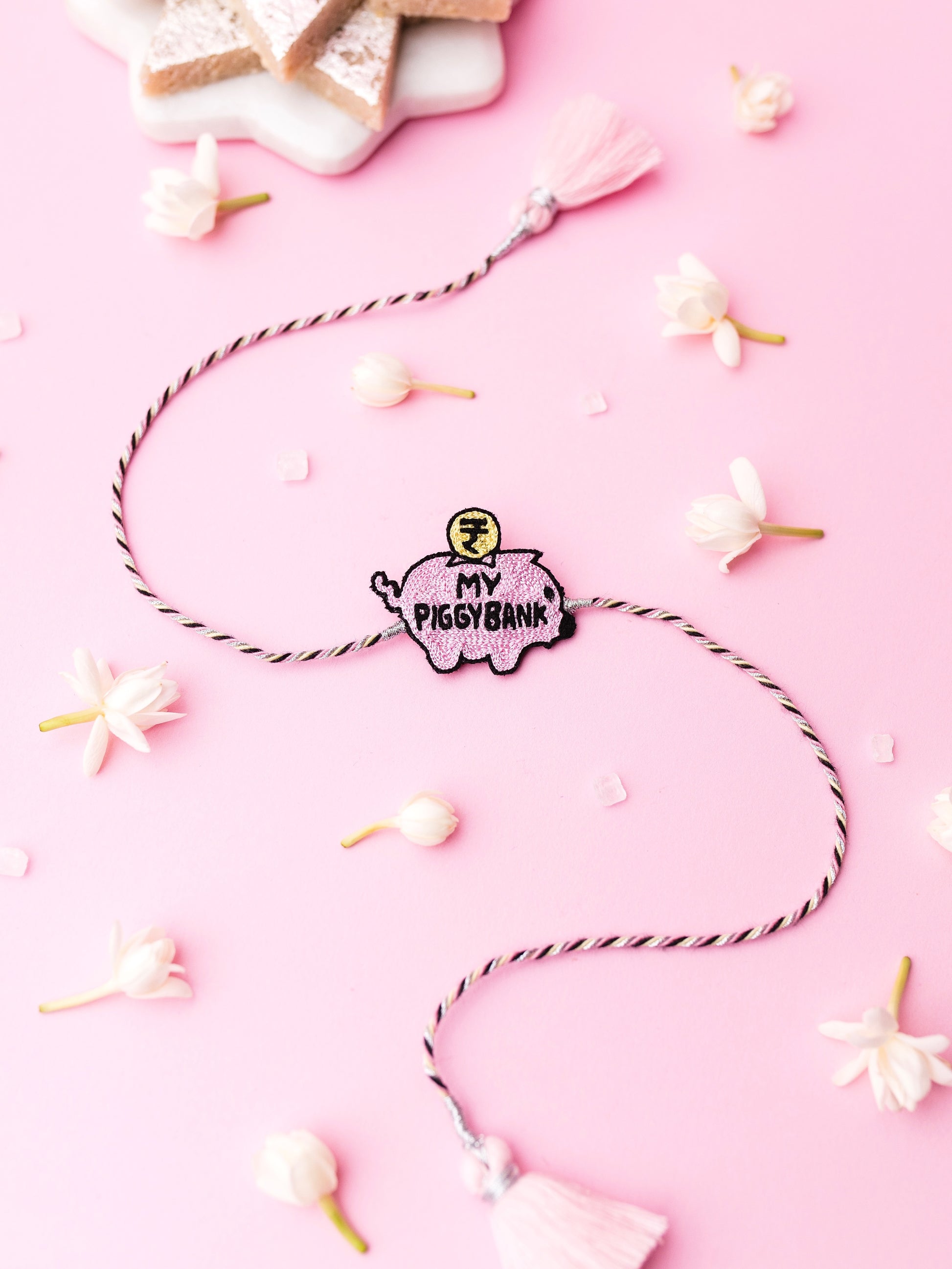 Decorative sister rakhi with my piggy bank text