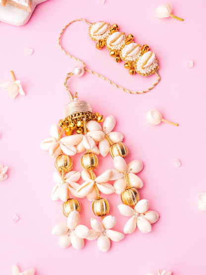 Decorative ivory lumba rakhi with cowrie details 