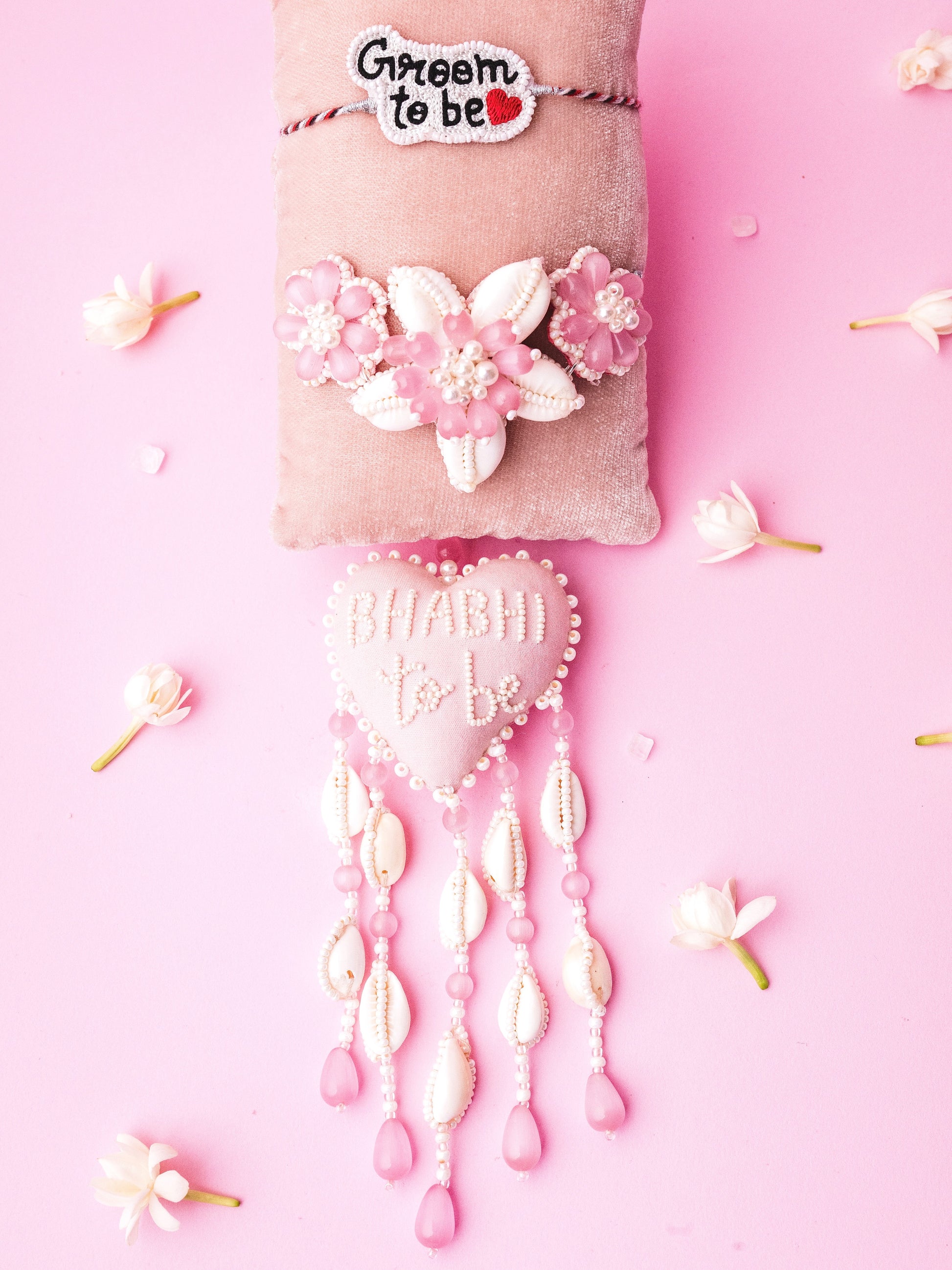 Decorative groom to be rakhi and bhabhi to be lumba with floral details 