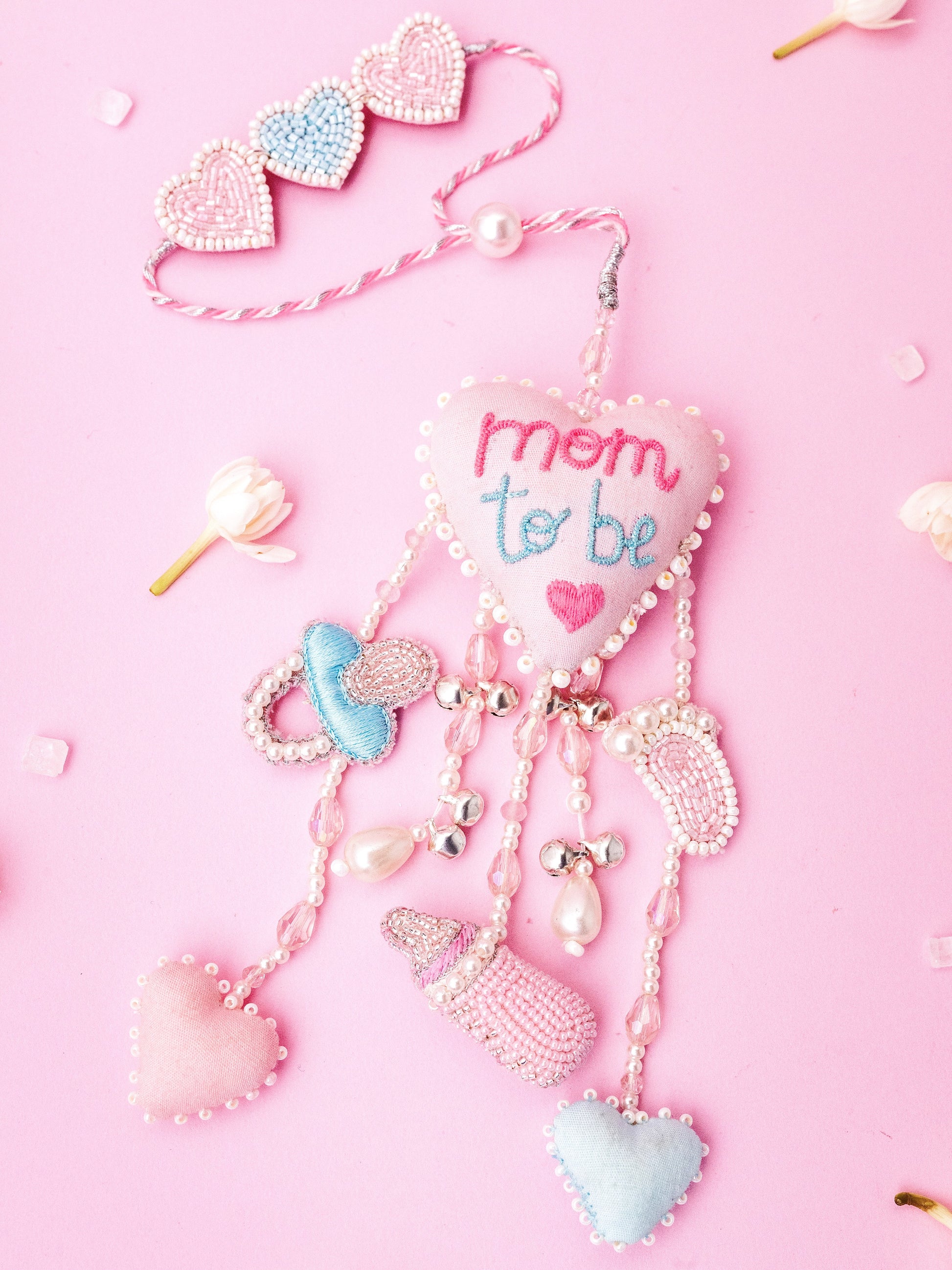 Decorative mom to be lumba rakhi with charms