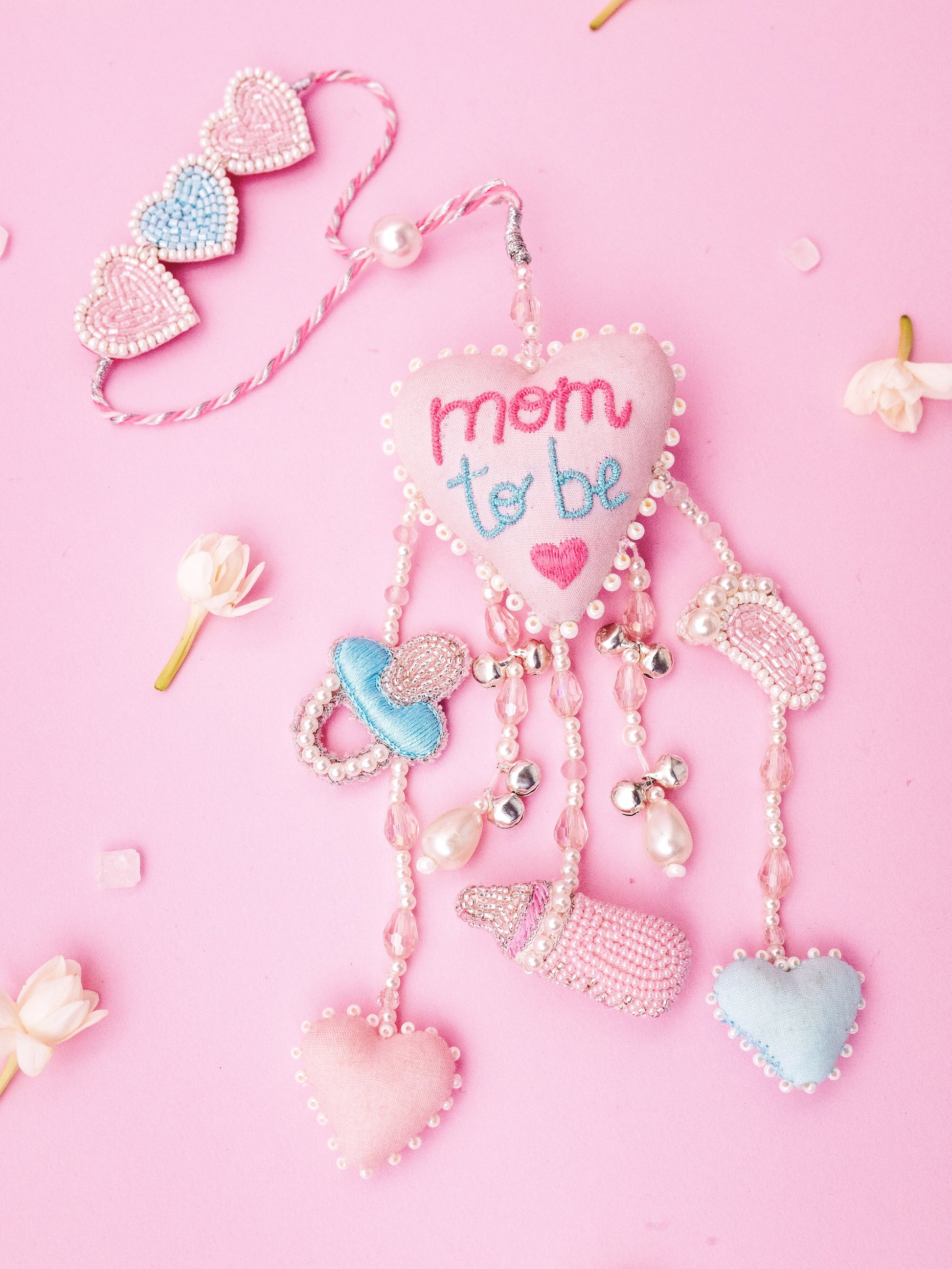 Decorative mom to be lumba rakhi with charms