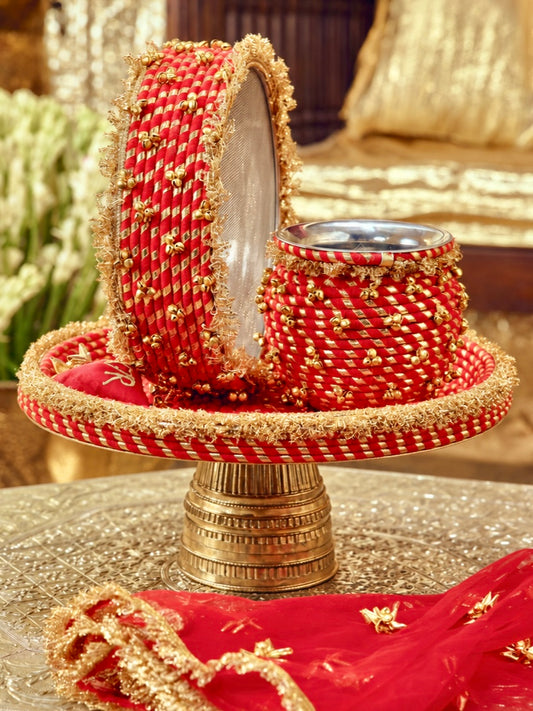 Kumkum red Karwa Chauth pooja hamper displayed as a coordinated handcrafted set