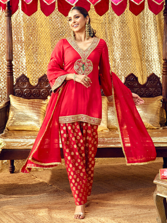 Model wearing the Tota Maina red farshi salwar set with handcrafted festive embroidery