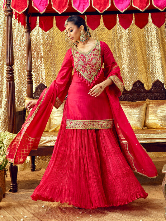 Model wearing the Gulaab red sharara set with handcrafted festive embroidery