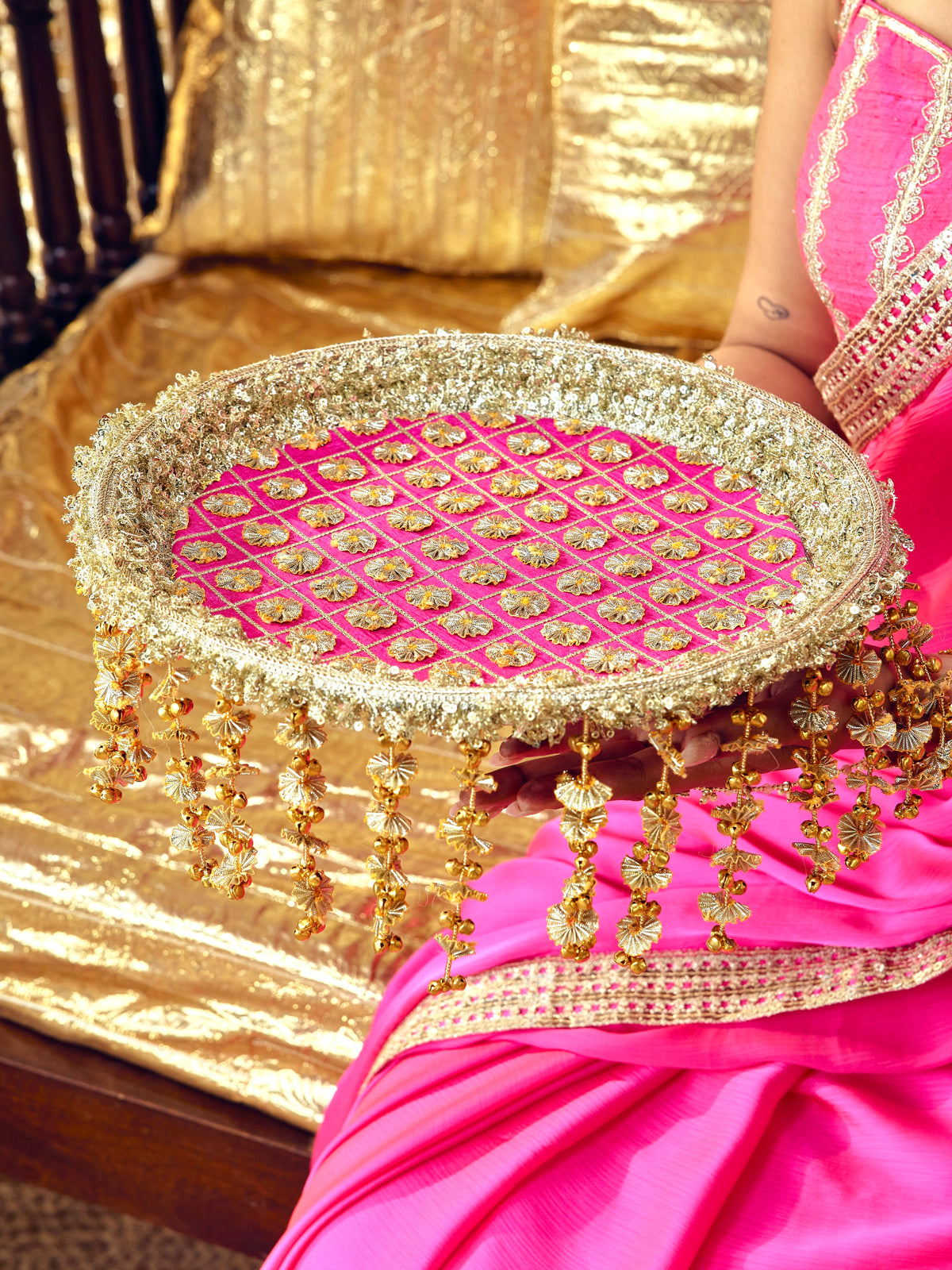 Chamak rani pink Karwa Chauth thal with intricate gota work and festive gold accents
