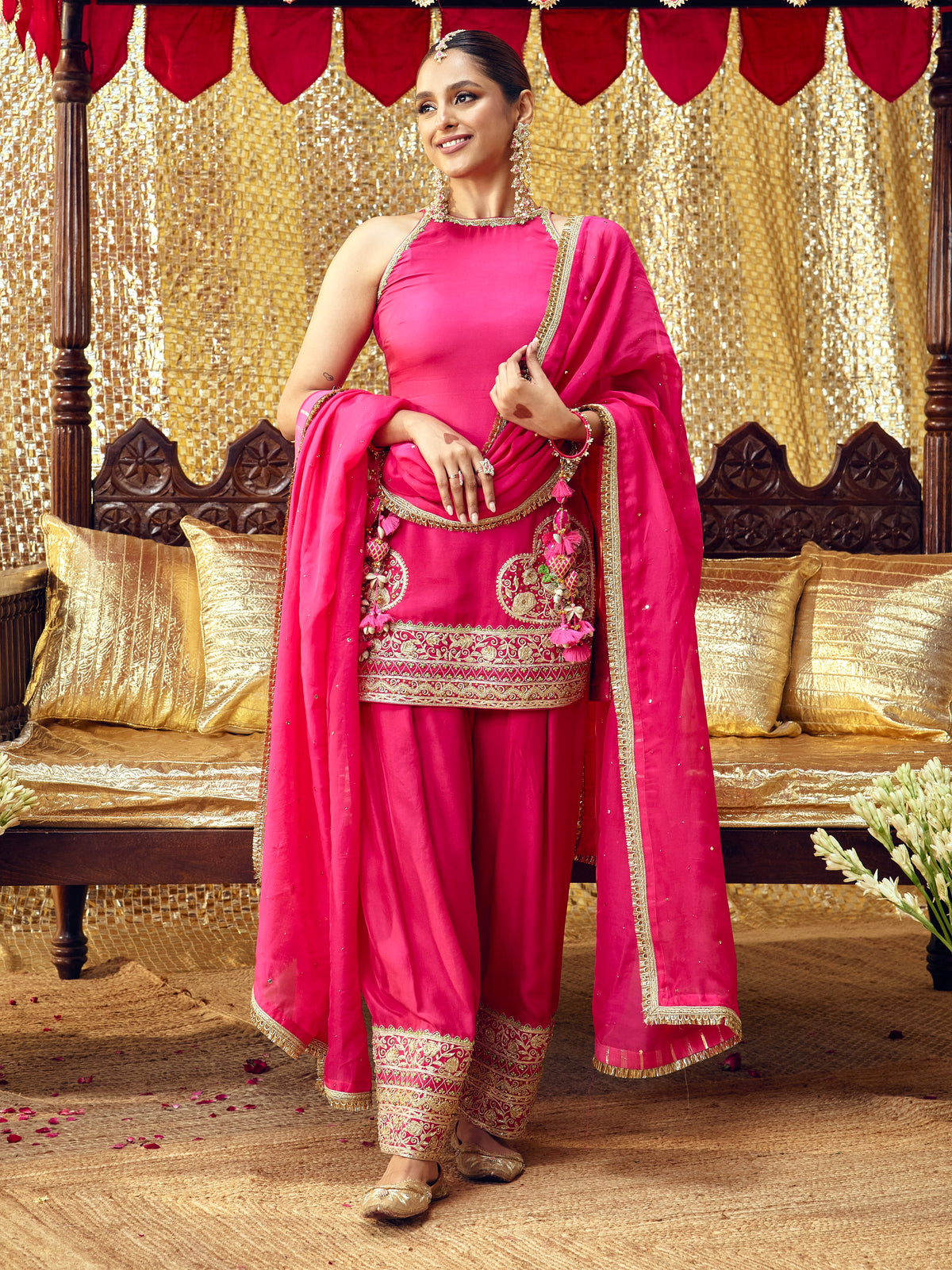 Model wearing the Tota Maina rani pink farshi salwar set with handcrafted festive embroidery