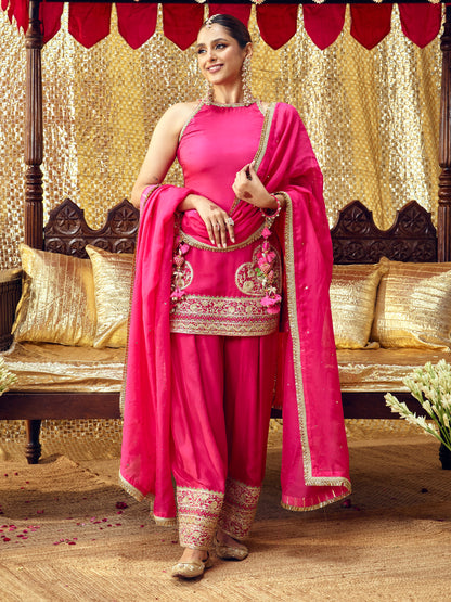 Model wearing the Tota Maina rani pink farshi salwar set with handcrafted festive embroidery