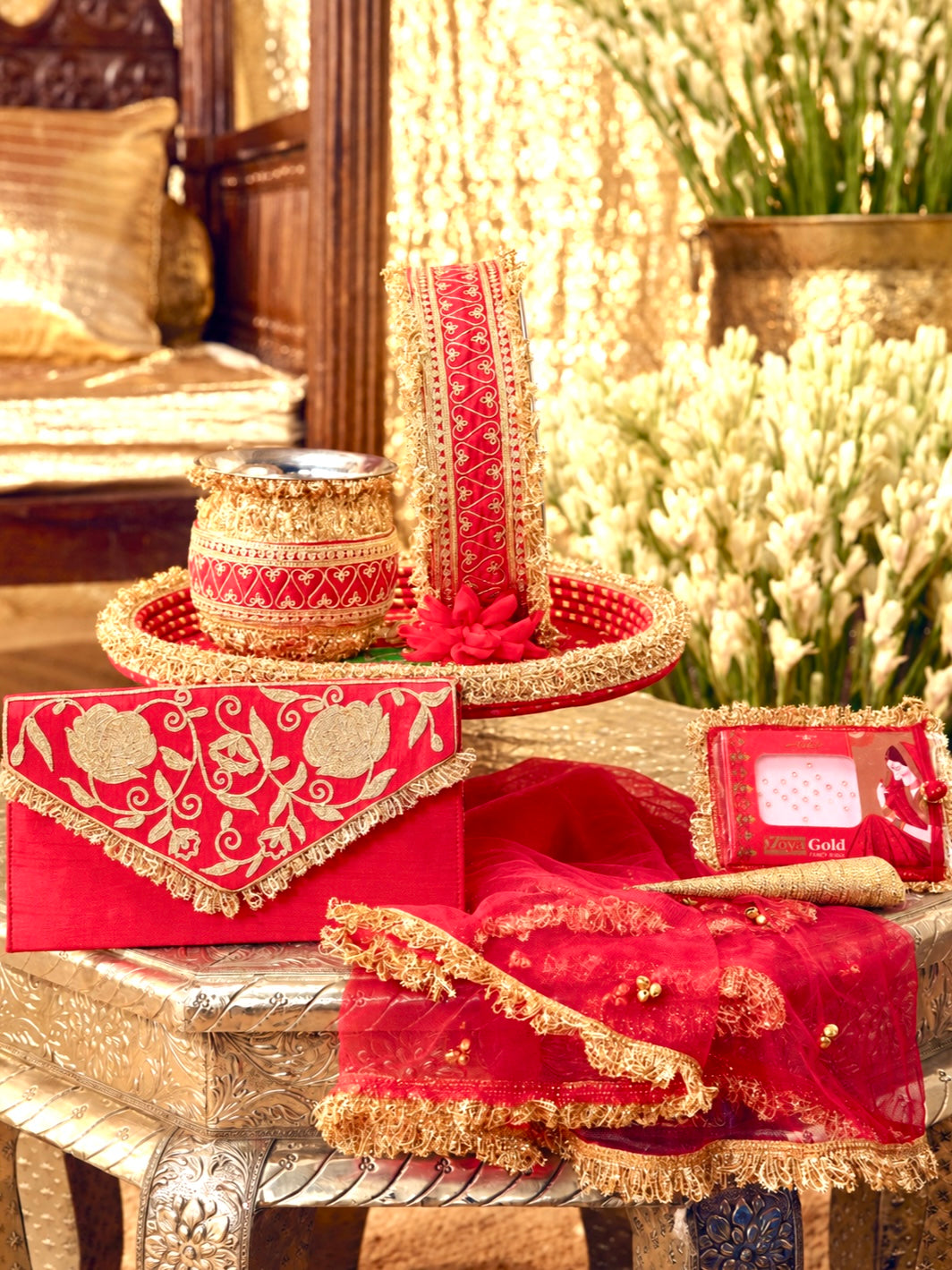 Tota Maina red Karwa Chauth pooja hamper displayed as a coordinated handcrafted set