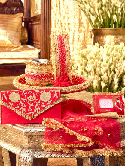 Tota Maina red Karwa Chauth pooja hamper displayed as a coordinated handcrafted set