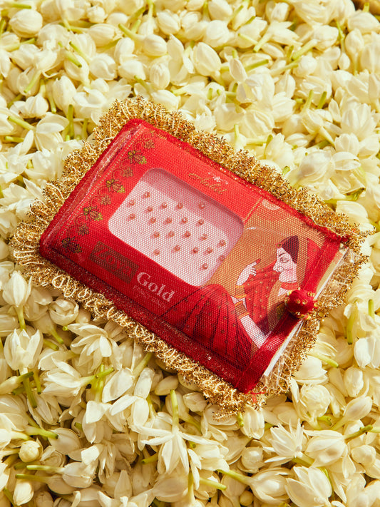 Chamak red bindi cover with intricate gota work and festive gold accents