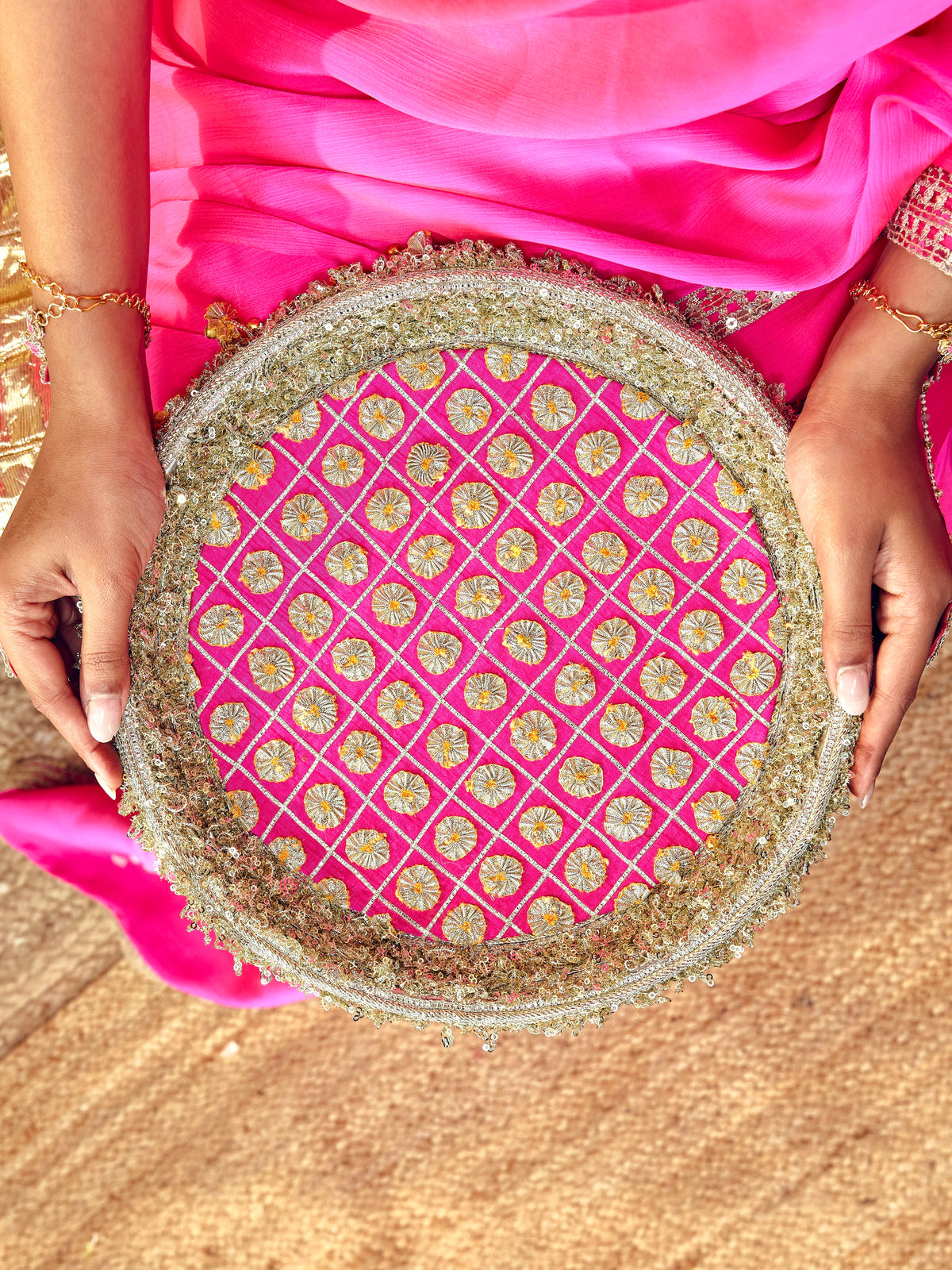 Chamak rani pink Karwa Chauth thal with intricate gota work and festive gold accents
