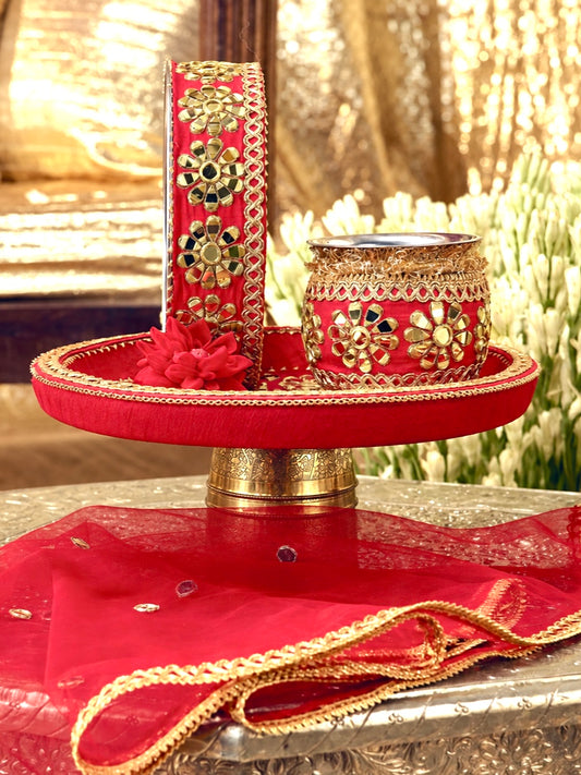 Sitara red Karwa Chauth pooja hamper displayed as a coordinated handcrafted set