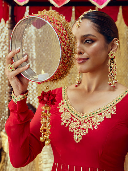 Chamak red Karwa Chauth channi with intricate gota work and festive gold accents