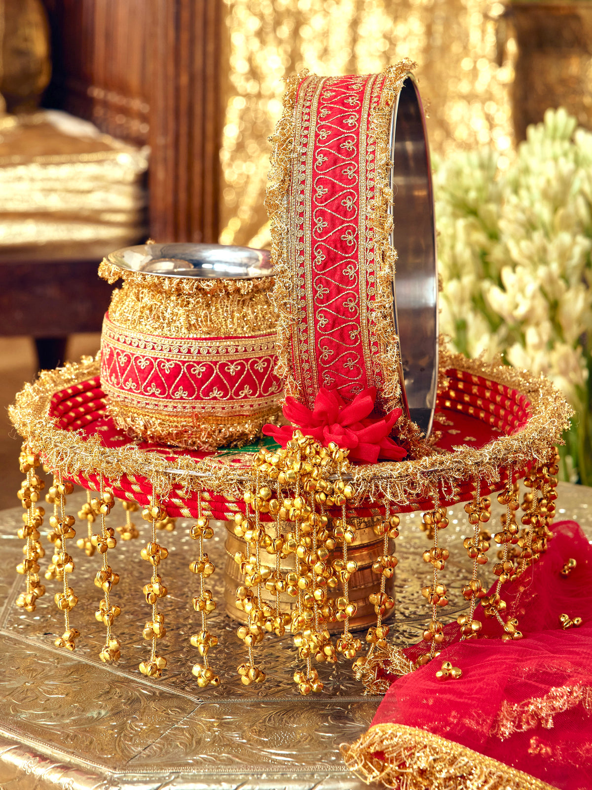 Tota Maina red Karwa Chauth pooja hamper displayed as a coordinated handcrafted set