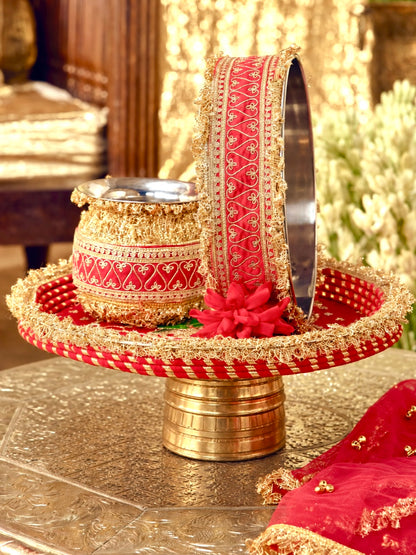 Tota Maina red Karwa Chauth pooja hamper displayed as a coordinated handcrafted set
