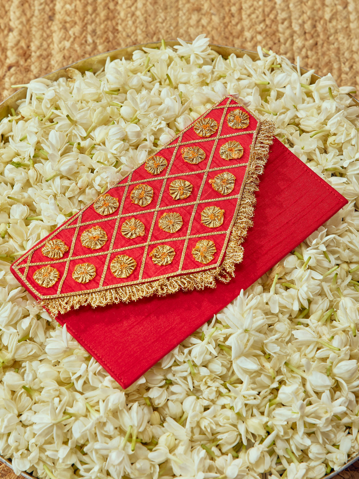Chamak red Karwa Chauth envelope with intricate gota work and festive gold accents